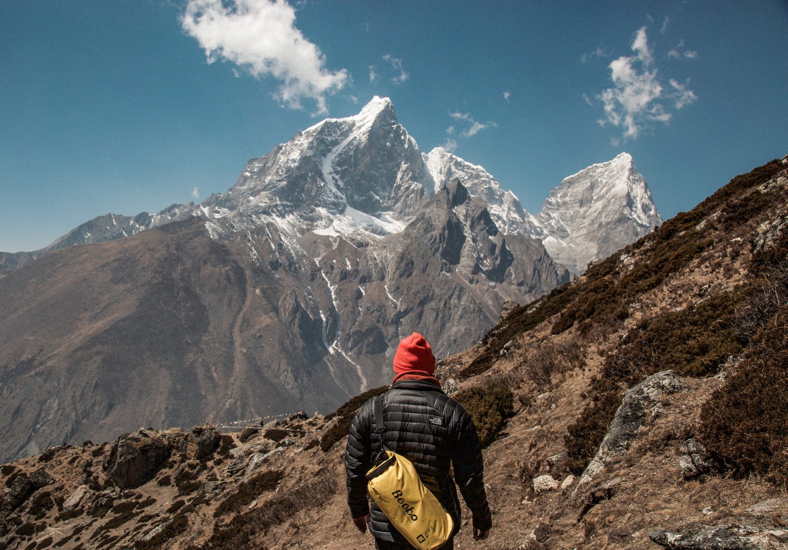 man in front of mountain